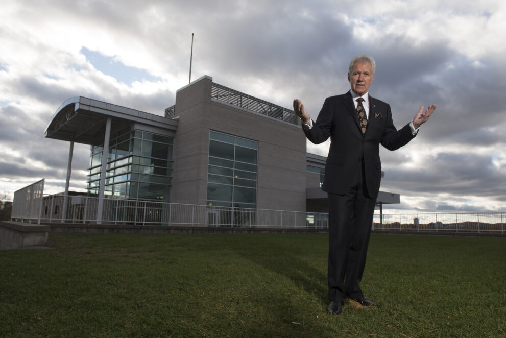 Alex Trebek stands outside 50 Sussex Drive